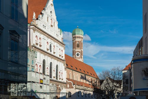 Facade of the St. Michaels Church and Tower of the Frauenkirche in Munich, Bavaria, Germany