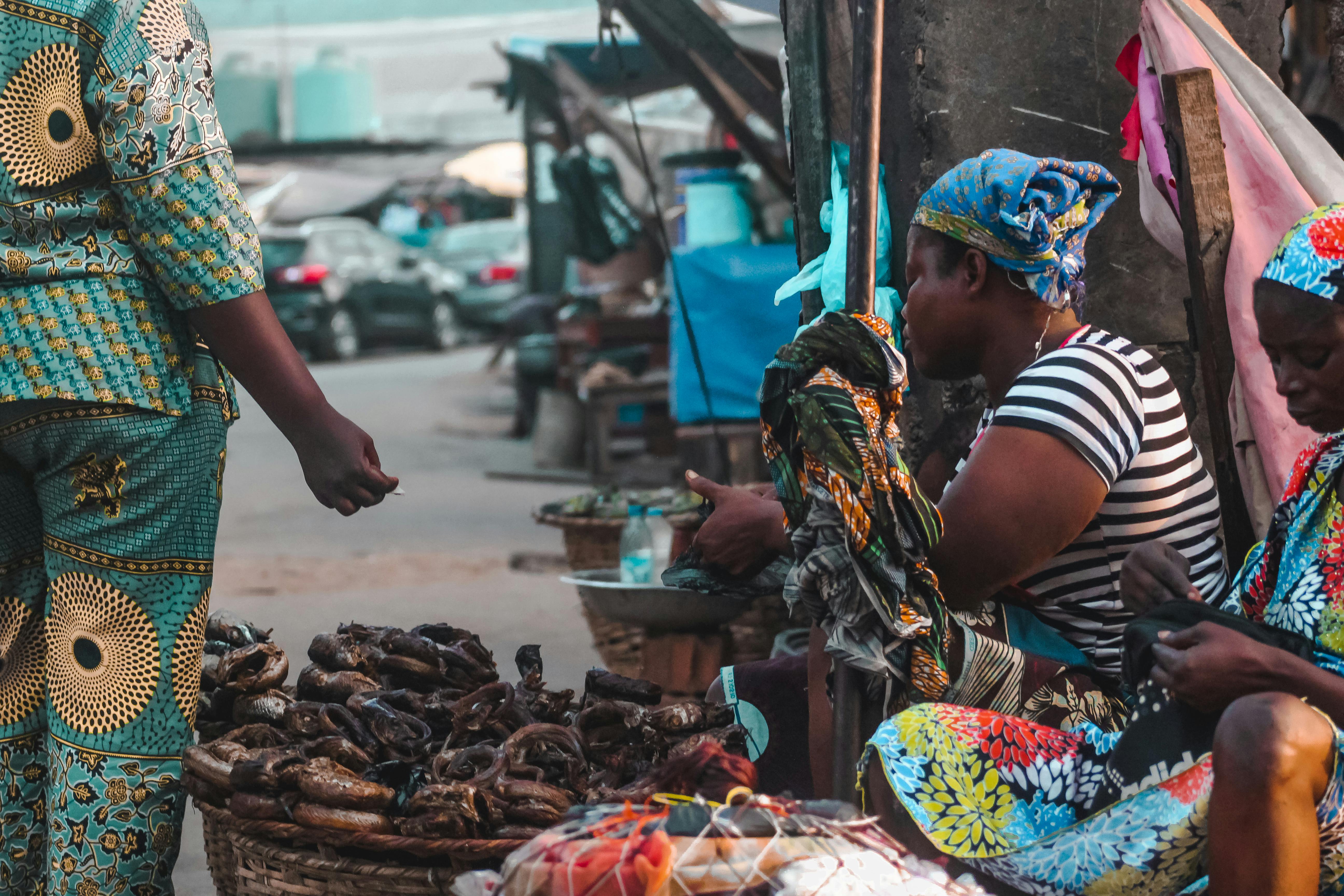 Local vendors selling food and crafts near Christ Embassy Loveworld Arena entrance