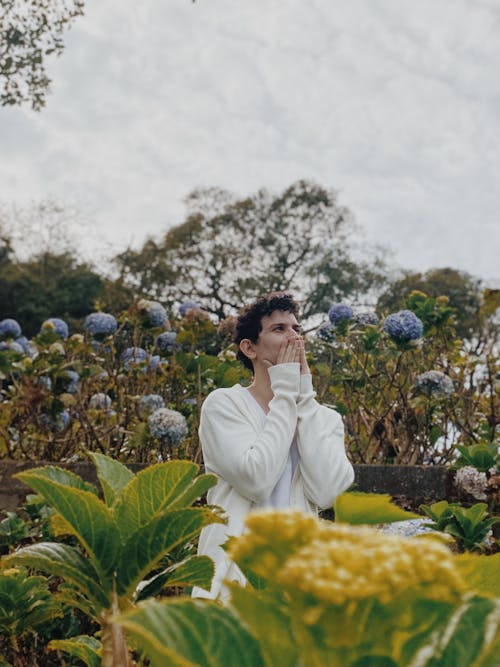 Man Standing in Garden