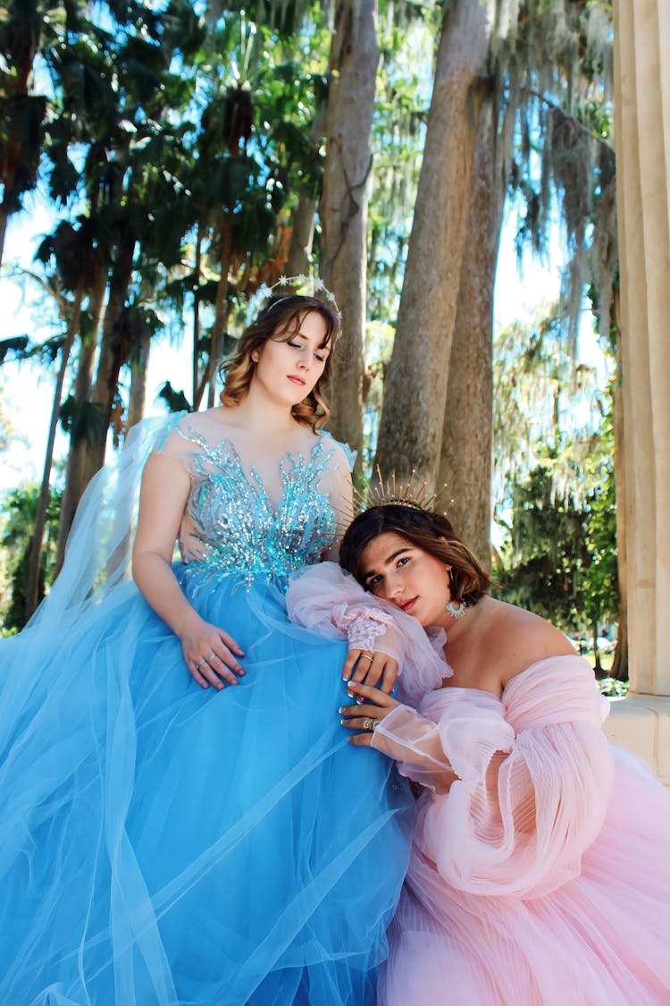 Women In Tulle Dresses Posing In Park