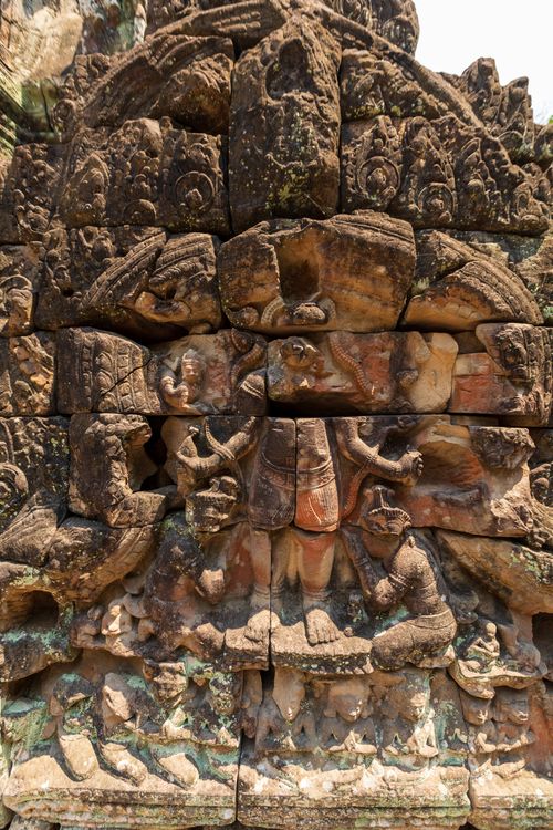 Free Detailed stone carvings depicting cultural history at an ancient temple. Stock Photo