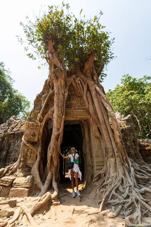 Woman Standing at the Entrance of Ta Som, Angkor, Cambodia