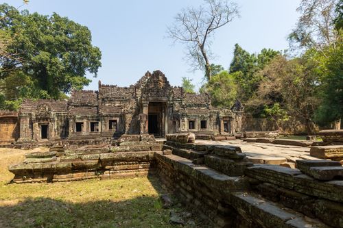 Free Explore the ancient ruins of a Cambodian temple, showcasing historical architecture in a lush setting. Stock Photo