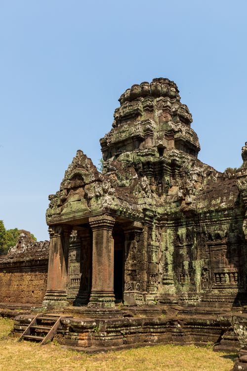 Free Ancient ruins of Angkor Wat temple in Siem Reap, Cambodia under a clear blue sky. Stock Photo
