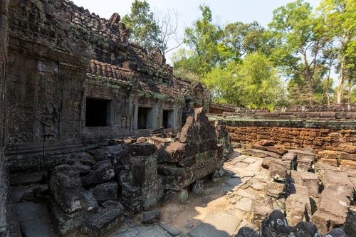 Free Explore the captivating ruins of an ancient Buddhist temple in the heart of Cambodia's jungles. Stock Photo