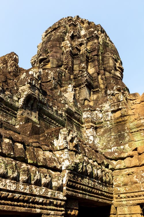 Free Historic stone ruins with intricate carvings under a clear blue sky. Stock Photo