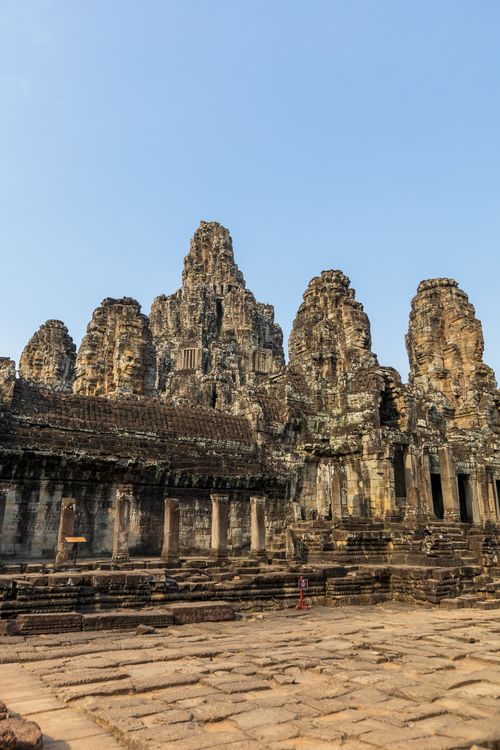 Free Explore the stunning ruins of Bayon Temple, Cambodia's historic landmark, under a clear sky. Stock Photo