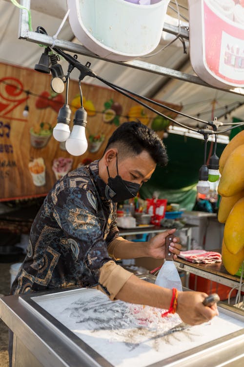 Man Preparing Rolled Ice Cream 