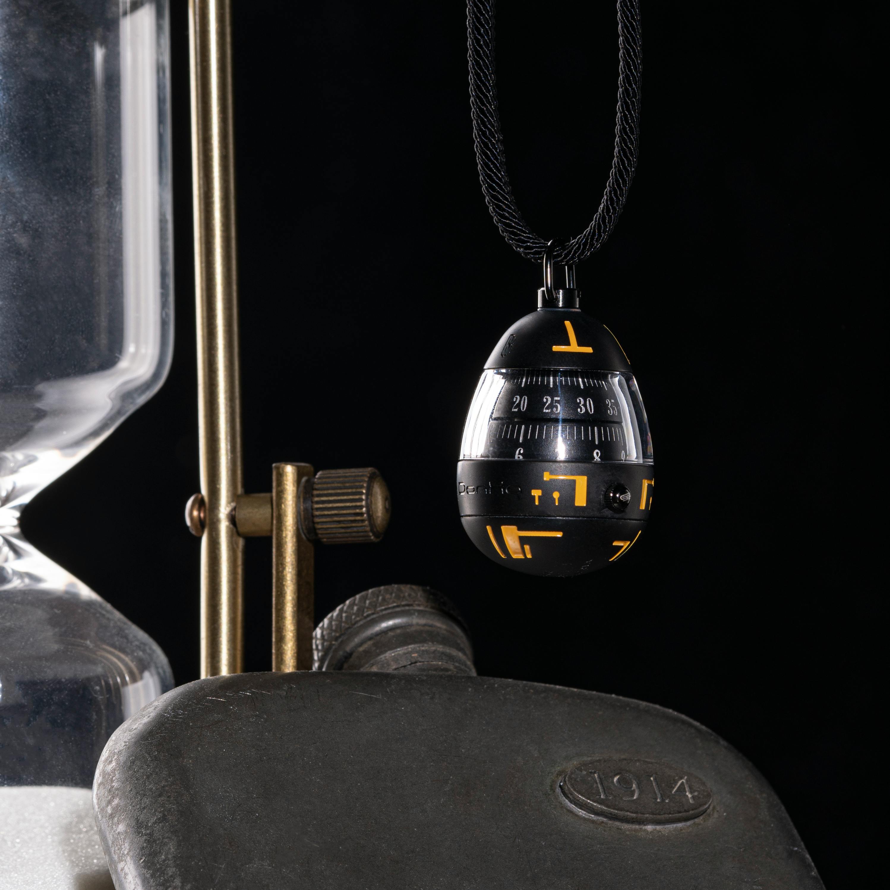 Item with Measure Hanging on Black Background