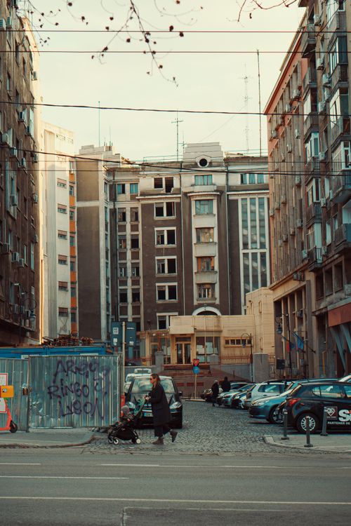 Free City street view with pedestrians and urban architecture in a downtown setting. Stock Photo