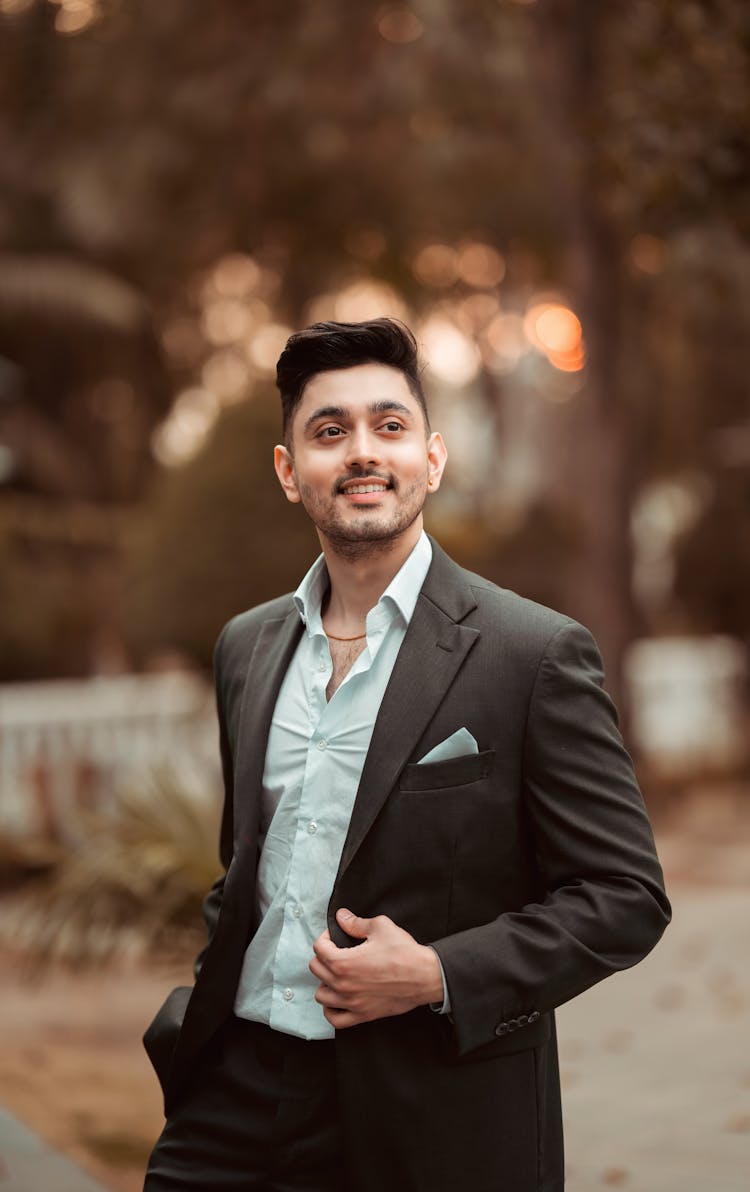 Smiling Man In Suit Posing On Street