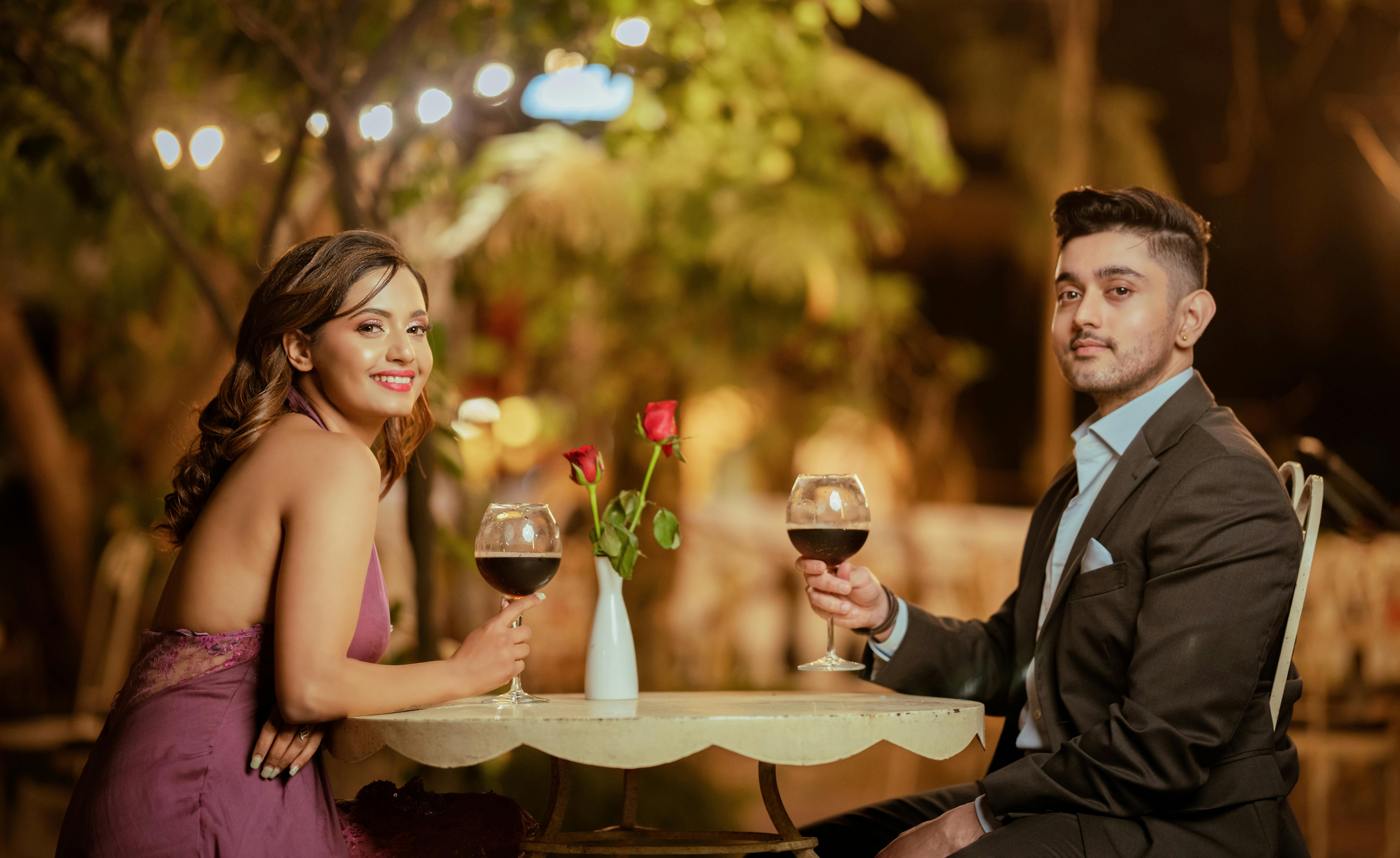https://images.pexels.com/photos/15930870/pexels-photo-15930870/free-photo-of-couple-drinking-wine-sitting-at-the-table.jpeg