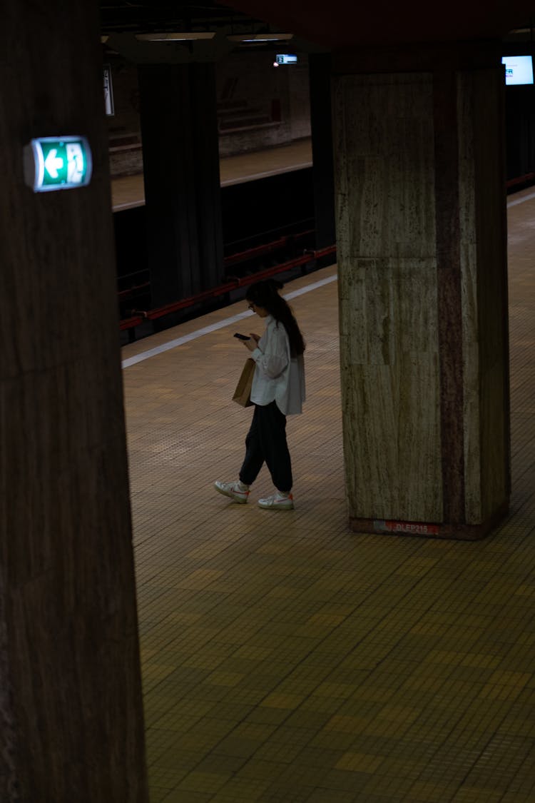 Woman Waiting On The Platform