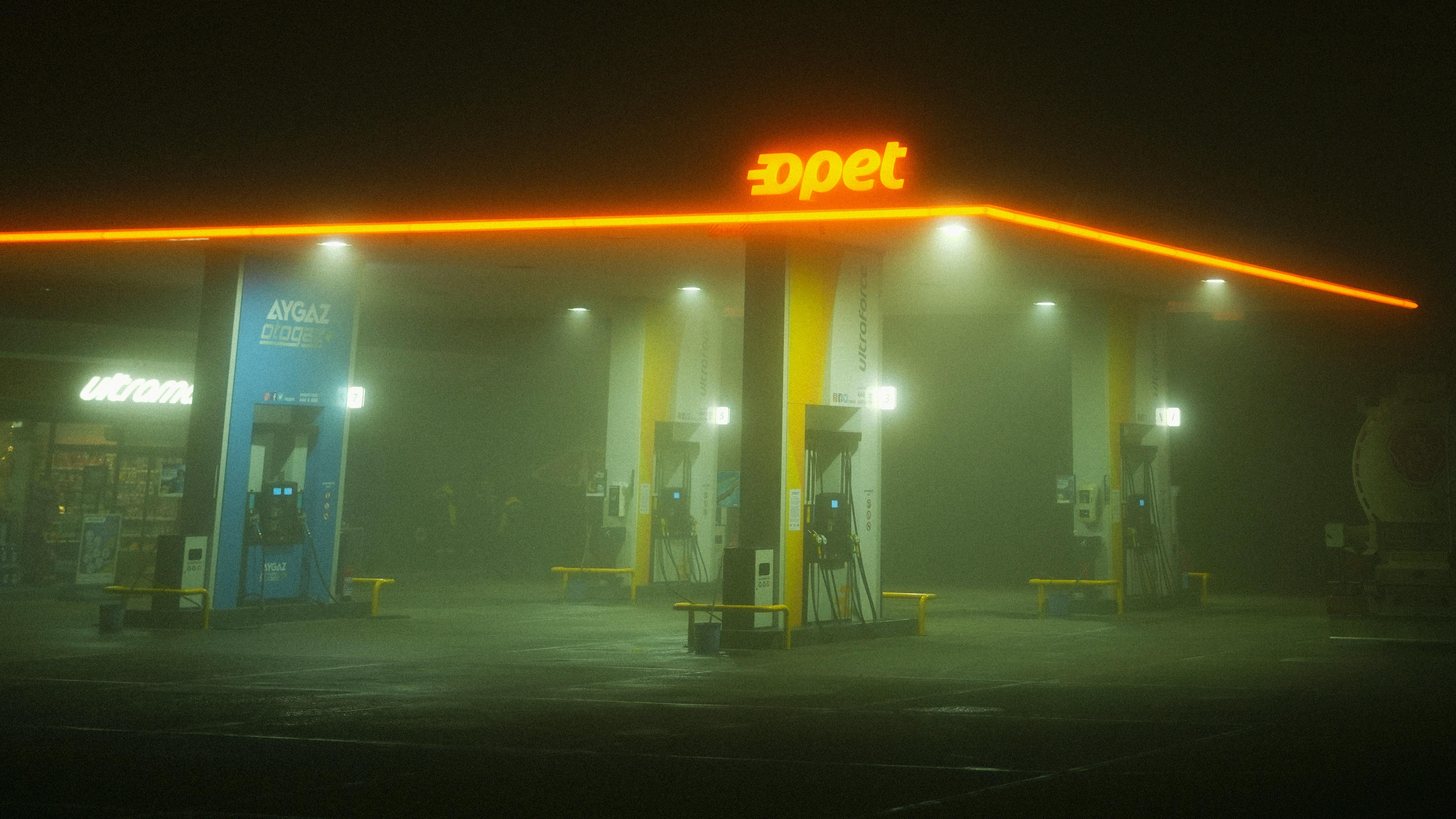 ITAP of a gas station on a rainy night (taken with original Google Pixel  from inside my car)
