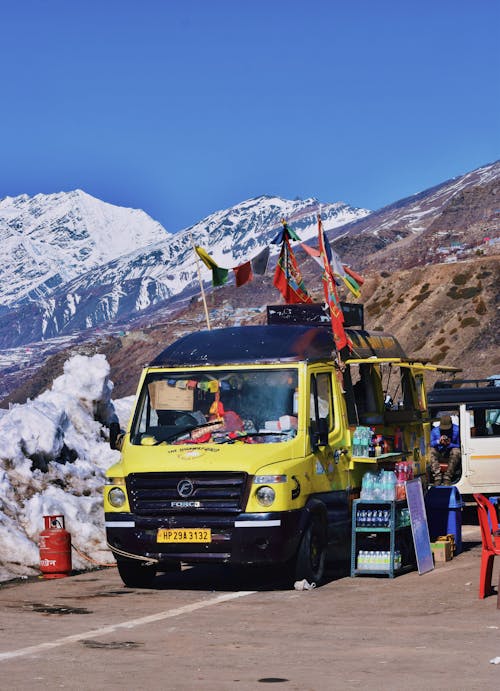 Food Truck on Road in Mountains