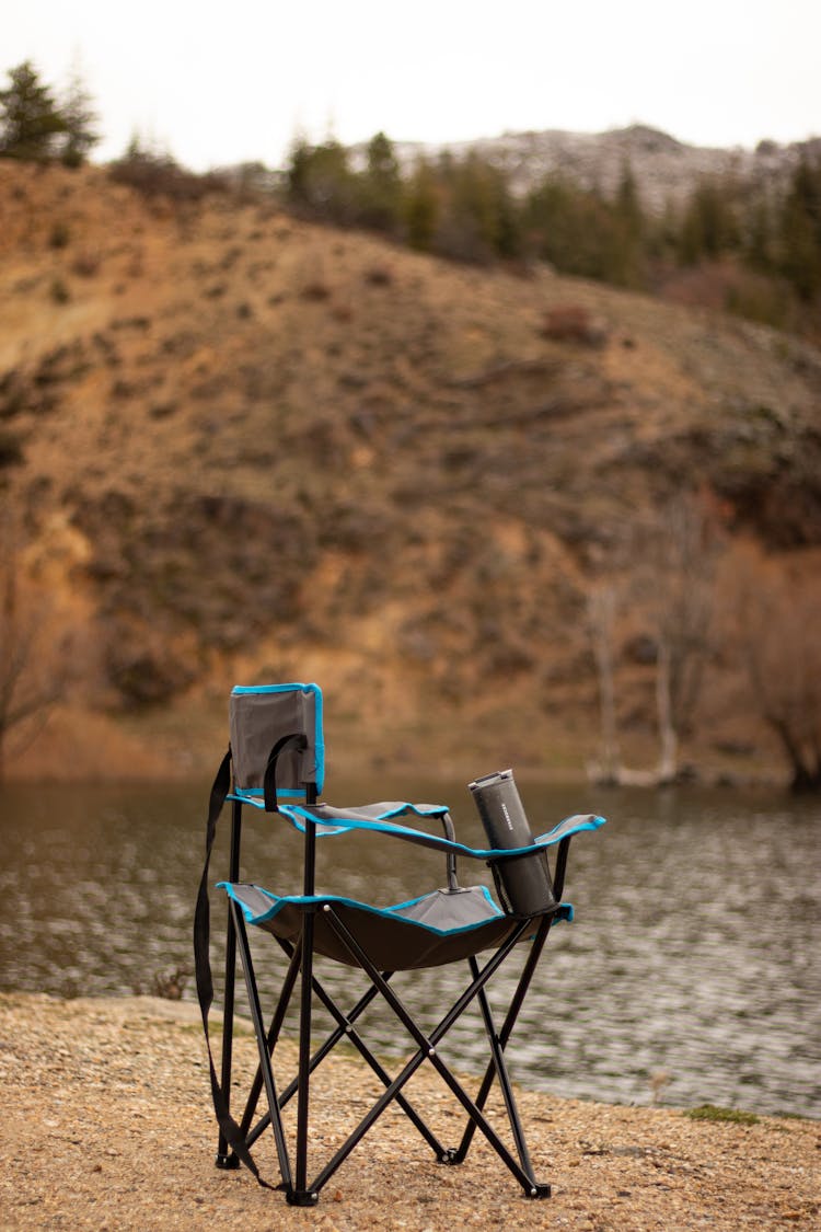 Empty Chair On Riverbank