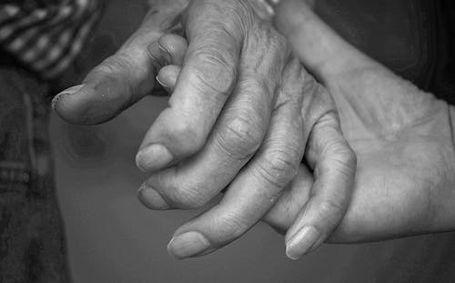 Close up of Elderly Couple Holding Hands