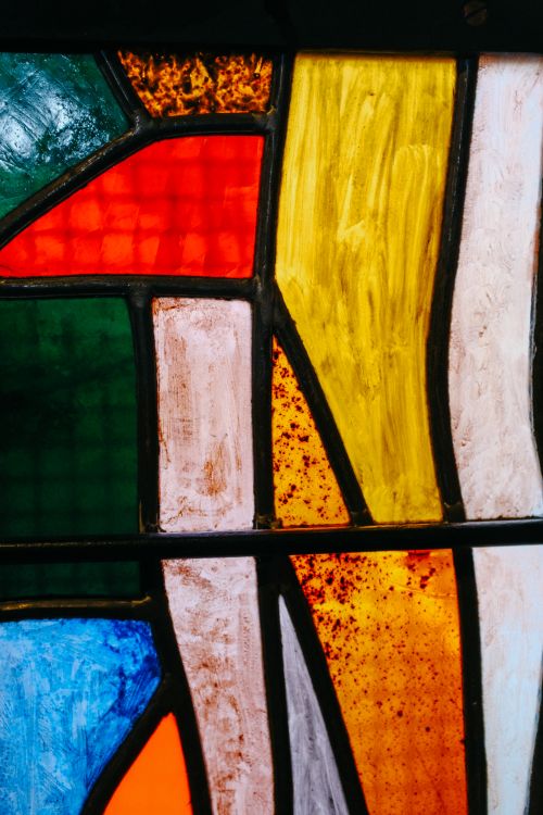 Free Vibrant abstract stained glass showcasing bold geometric patterns and colors. Stock Photo
