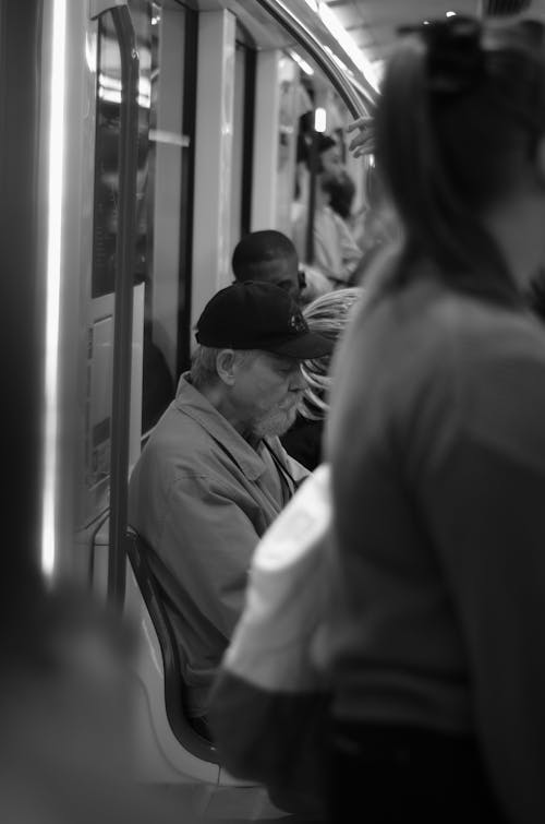 Candid Picture of an Elderly Man in a Subway 