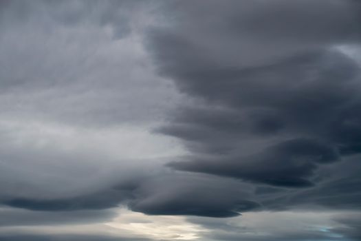 Moody overcast sky featuring layers of dark, dramatic clouds suggesting an impending storm.. moody, overcast, featuring