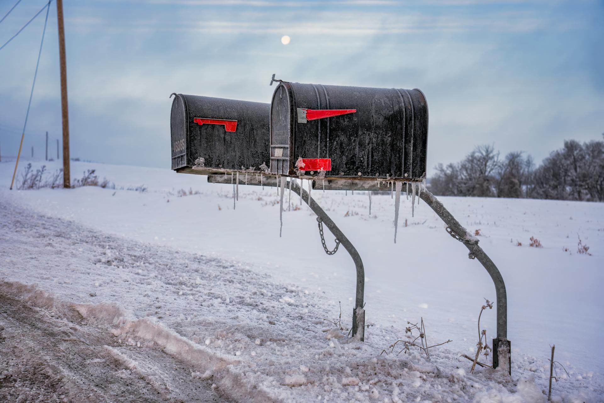 Icicles on Mailboxes on the Side of the Road in Winter