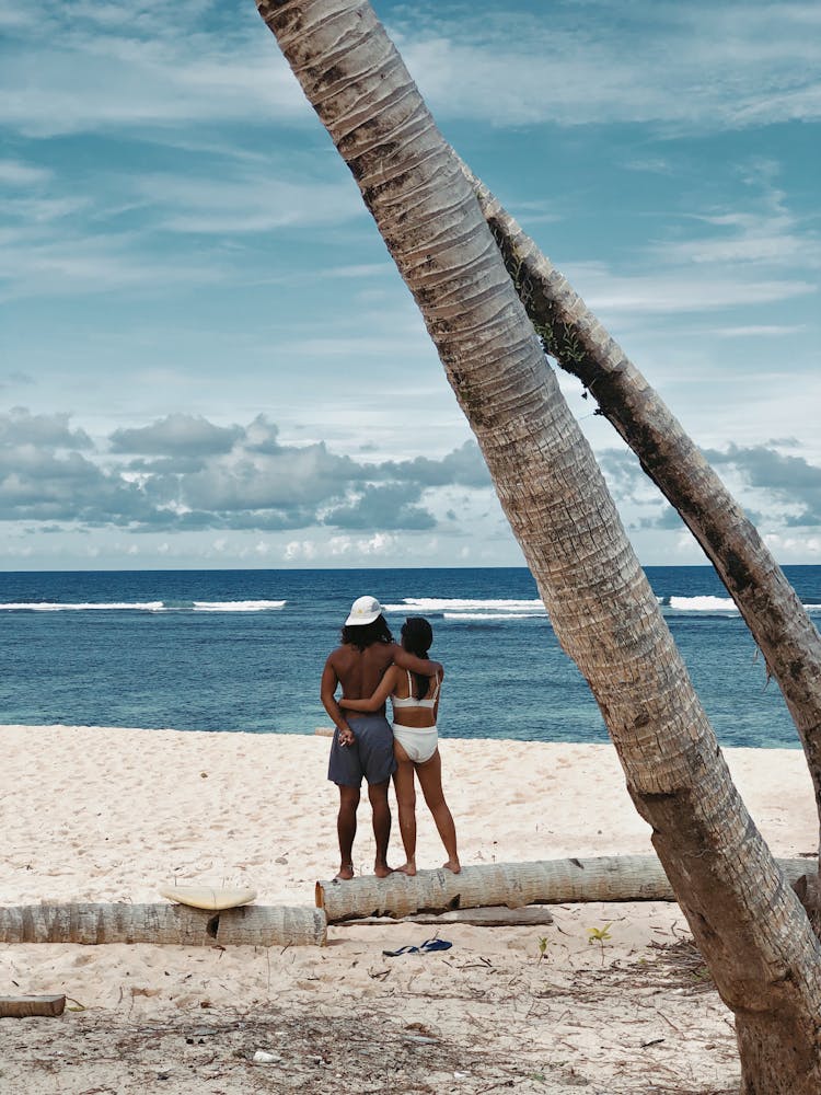 Couple Hugging On Beach