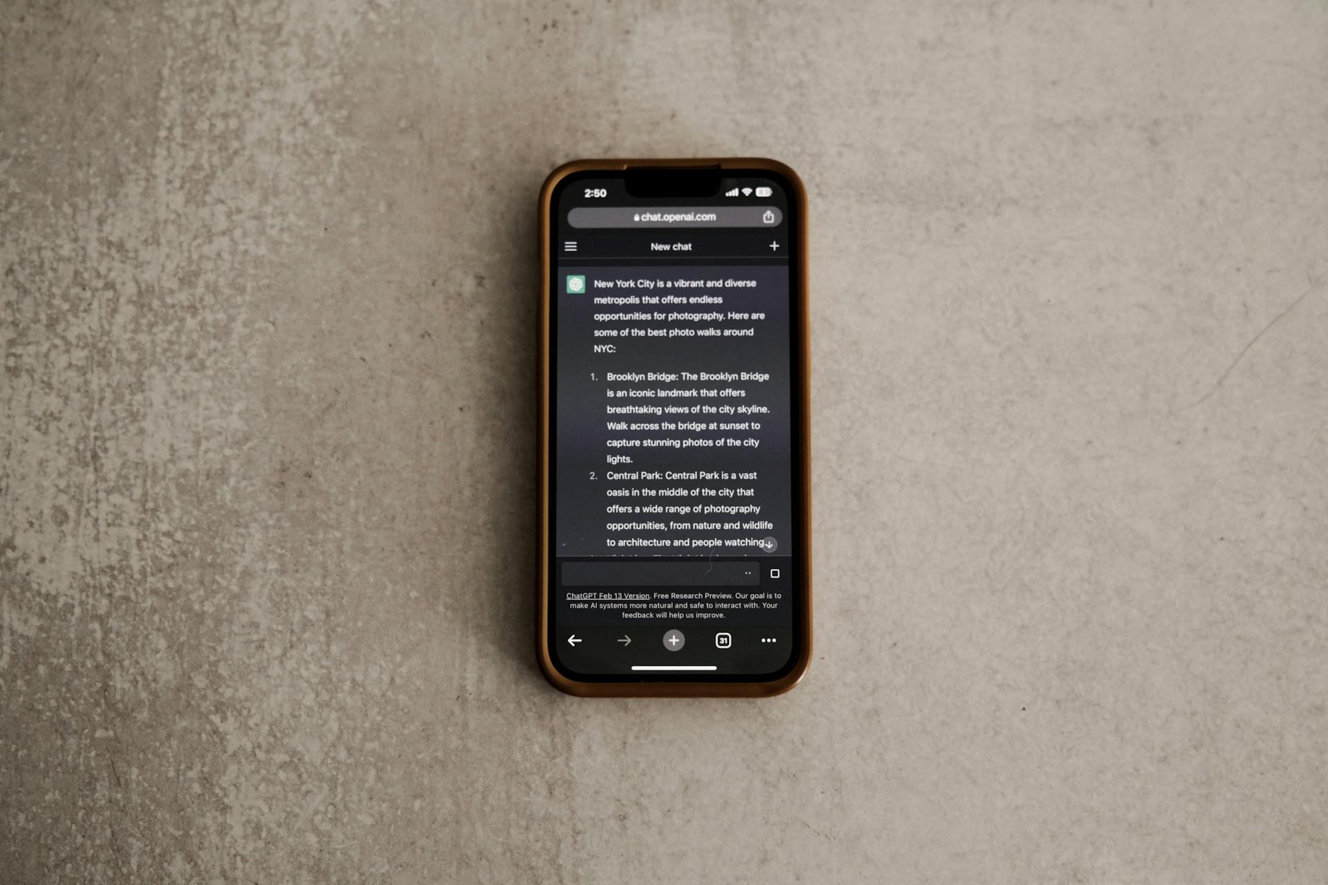 Smartphone on a textured surface showing text, ideal for tech or lifestyle themes.