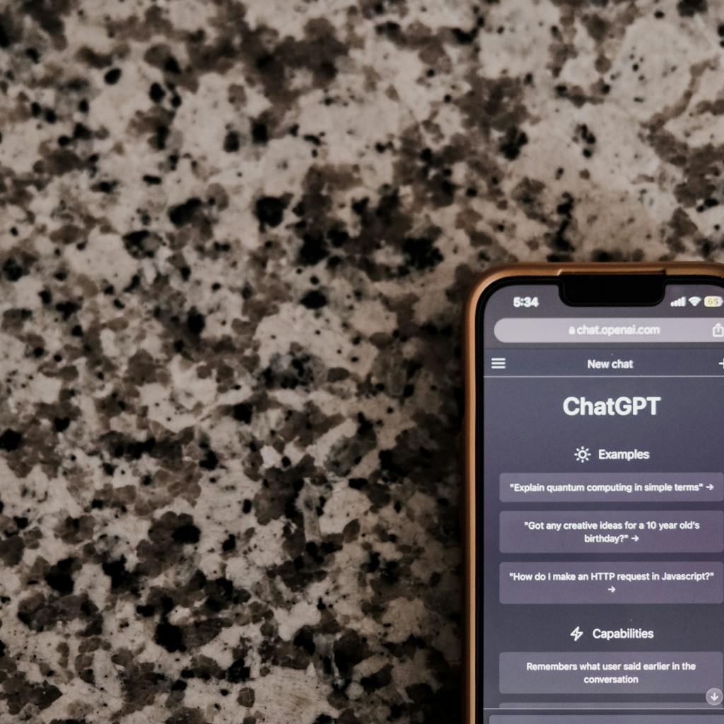 Smartphone displaying ChatGPT interface, AI chatbot.