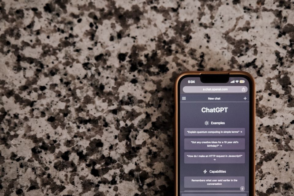 Person chatting with an AI companion app on a smartphone