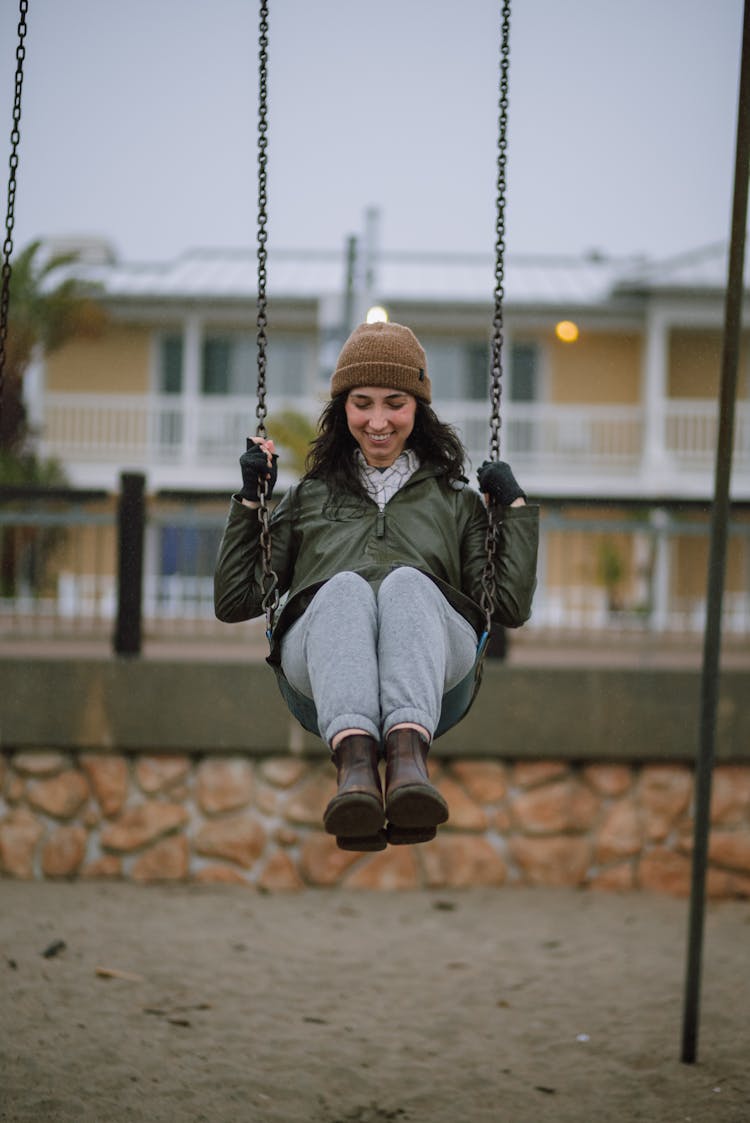 Woman Swinging On Swing