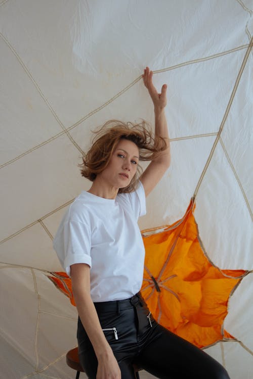 Woman Posing in Studio against Parachute