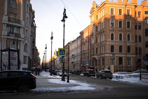 Free Panoramic view of snow-covered streets and classical architecture in Saint Petersburg, Russia during winter dusk. Stock Photo