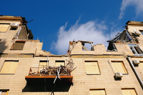 Collapsed Residential Building under Blue Sky