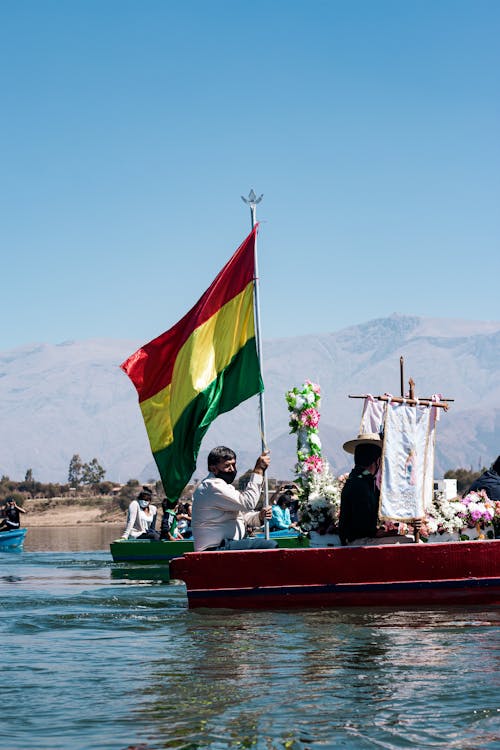 Man with Bolivian Flag in Boat