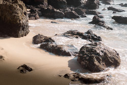 Free A beach with rocks and sand Stock Photo