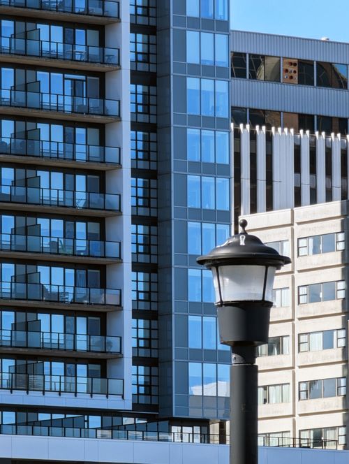 Free Contemporary buildings in Halifax, Nova Scotia, framed by a stylish streetlamp. Stock Photo