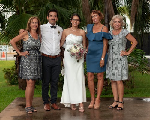 Smiling Newlyweds with Guests