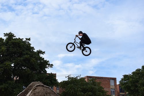 Man on Bicycle Midair