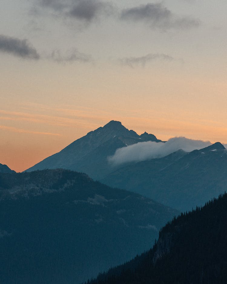 Mountains In Fog On Sunset