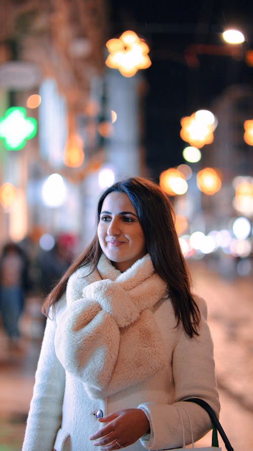 Smiling Brunette in Coat 