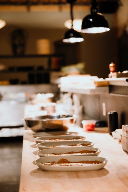 chef preparing fresh seasonal small plates kitchen
