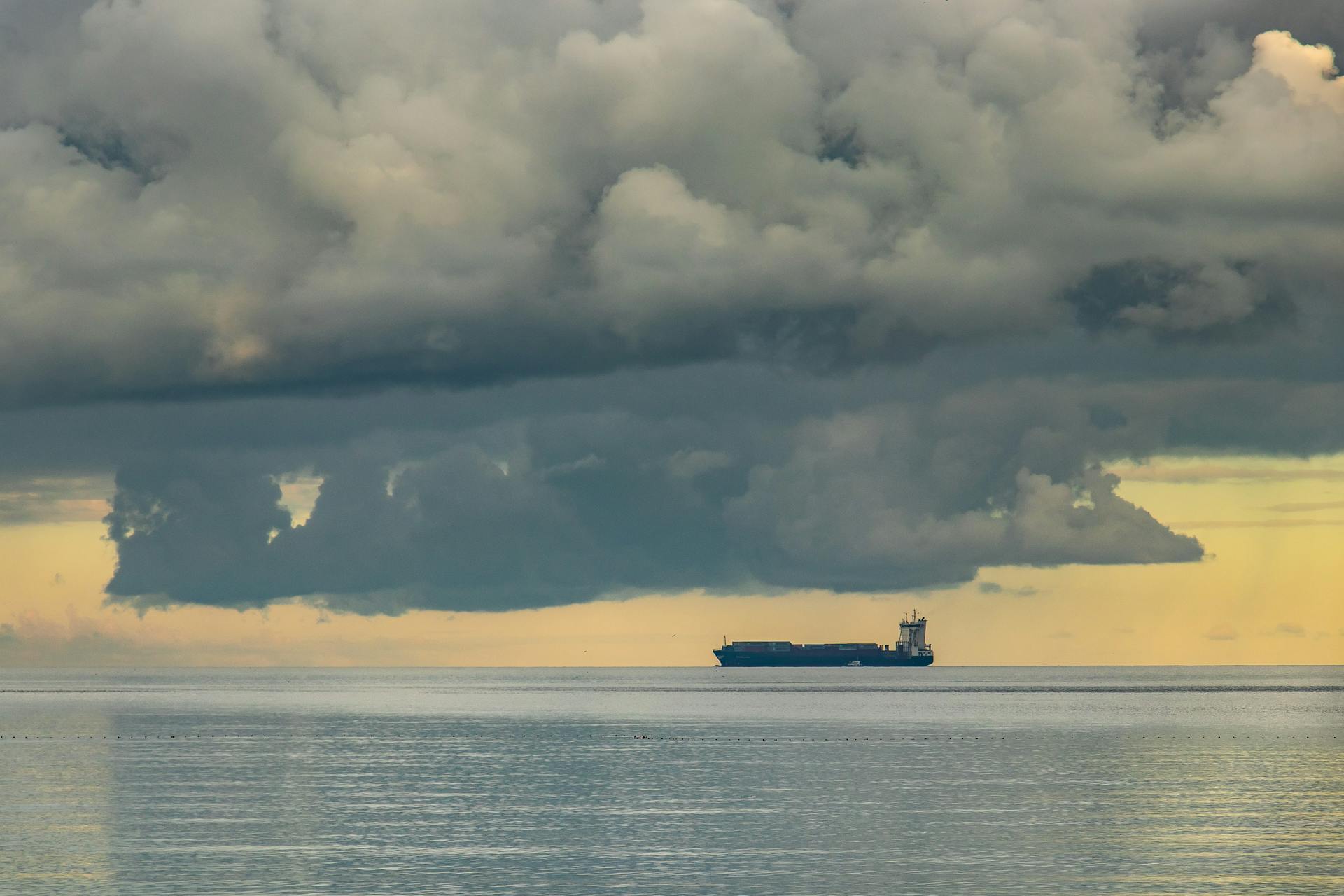 A solitary oil tanker sails under dramatic clouds on the Tunisian coast near Radès.