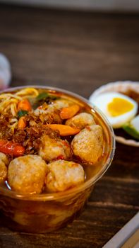 Delicious spicy Indonesian meatball soup served with boiled egg and vegetables. - Fotografer Sidoarjo