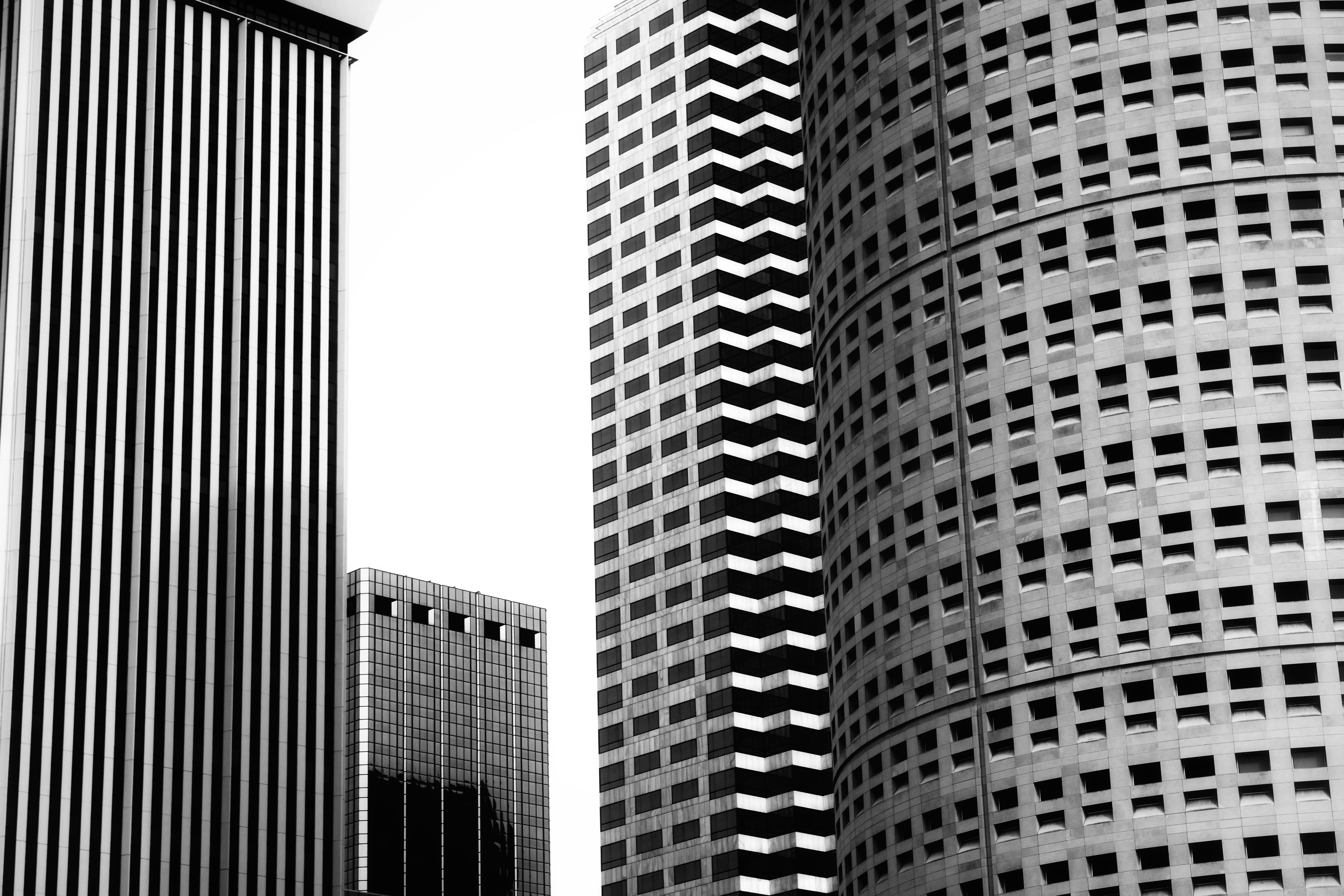 A black and white photo of tall buildings · Free Stock Photo