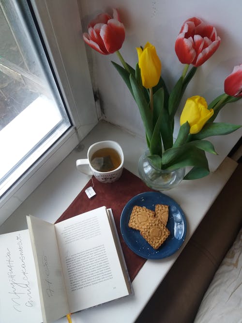 Book, Flowers, Cookies and Tea on Windowsill