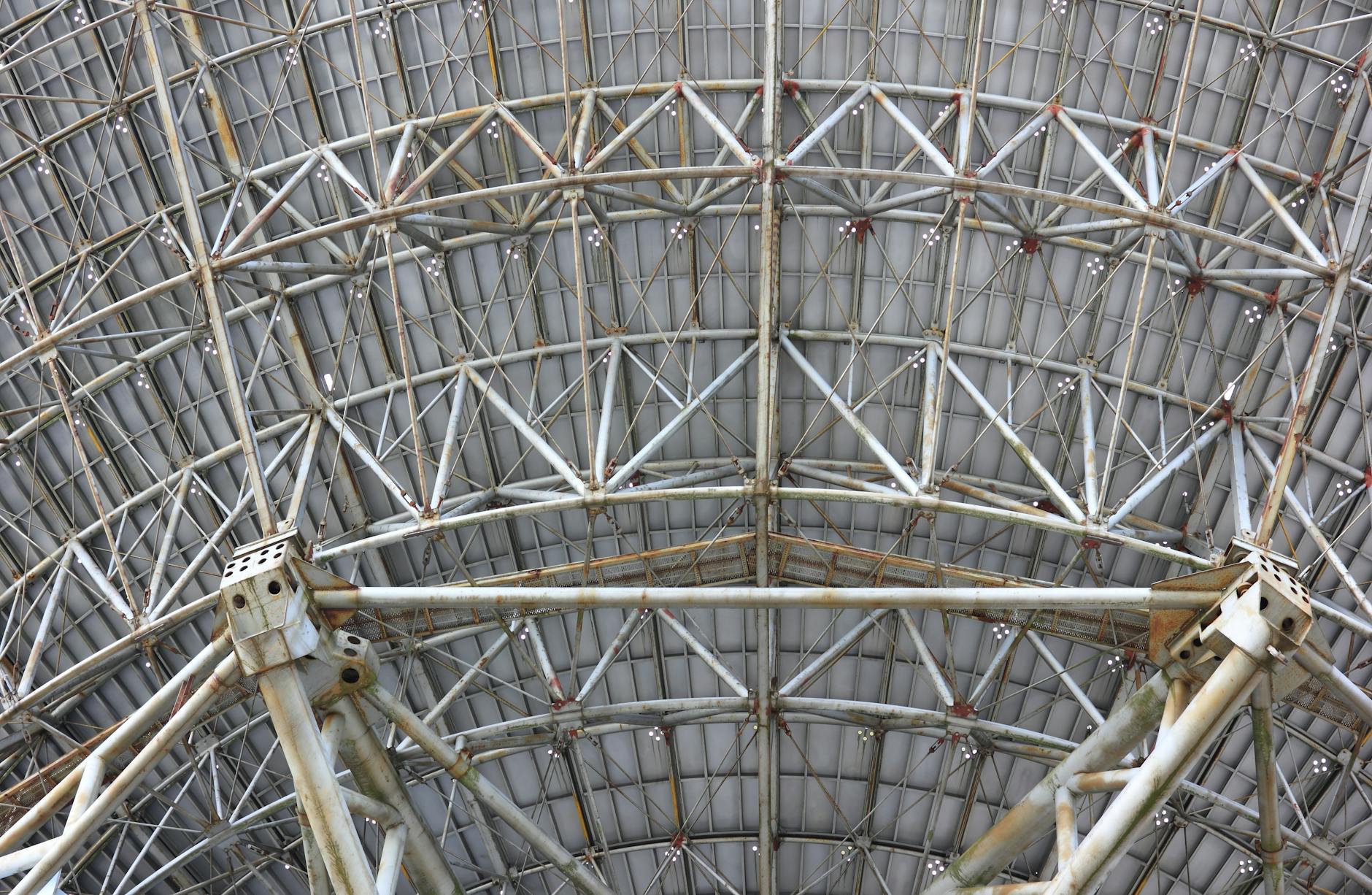 Close-up image of a complex steel framework structure in Irbene, Latvia, showcasing industrial design.