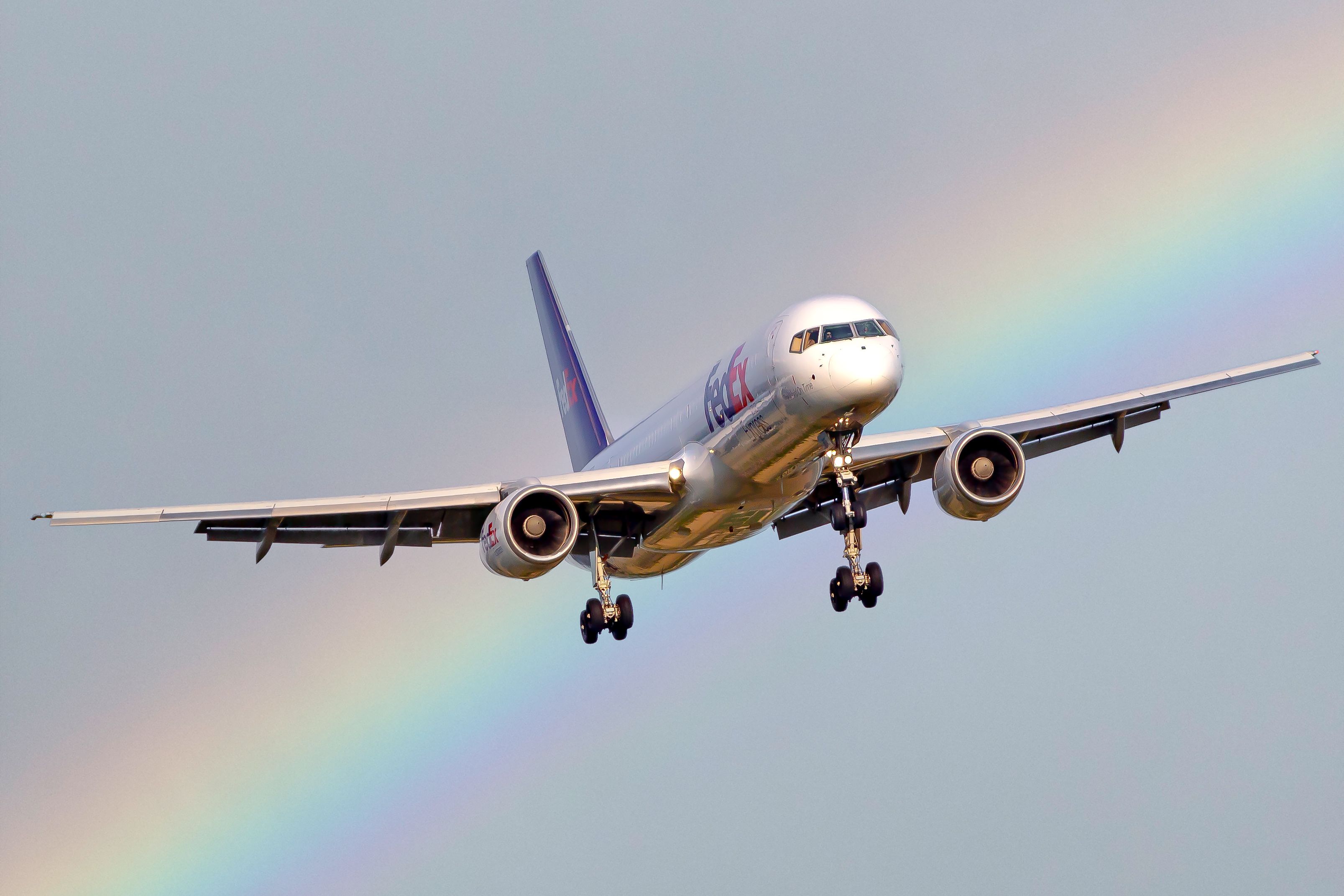 Rainbow behind Cargo Airplane · Free Stock Photo