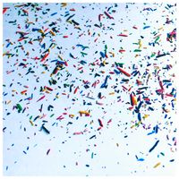 Multi-coloured confetti scattered on a pale surface — photo by Ewel Z on Pexels
