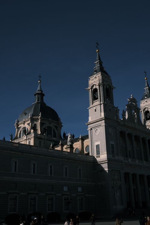 Free Breathtaking view of a historic cathedral with striking domes and towers under a clear sky. Stock Photo
