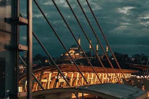 Night Photo of the Golden Horn Bridge in Istanbul with a Mosque in the Background